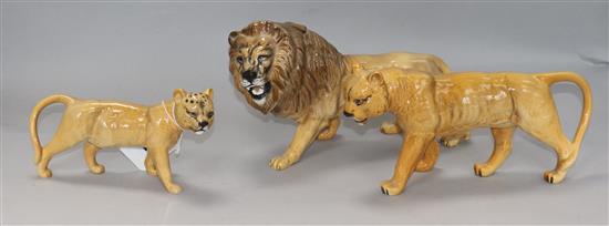 A collection of Beswick Lions: Lion 2089, Lioness facing left 1507, Lion cub 1508